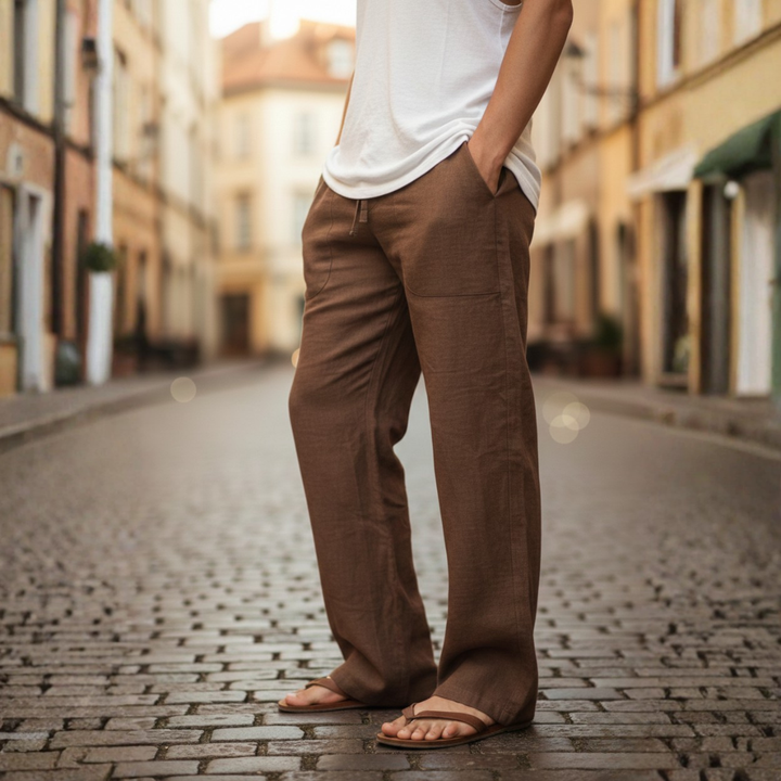 Folded men's loose fit linen drawstring trousers, ready for summer adventures & beachwear.