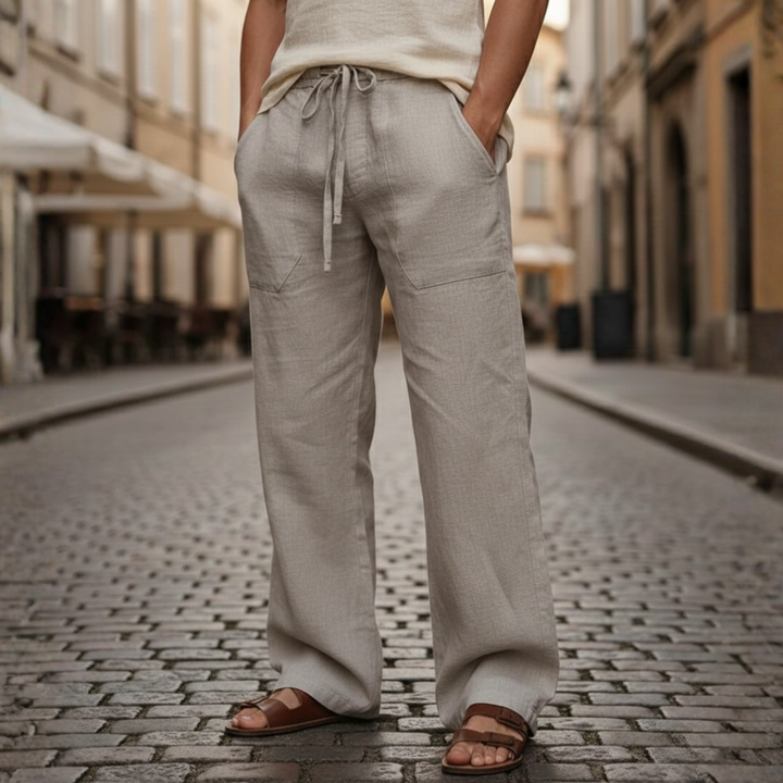 Men's summer outfit featuring comfortable, loose fit linen drawstring trousers and a shirt.