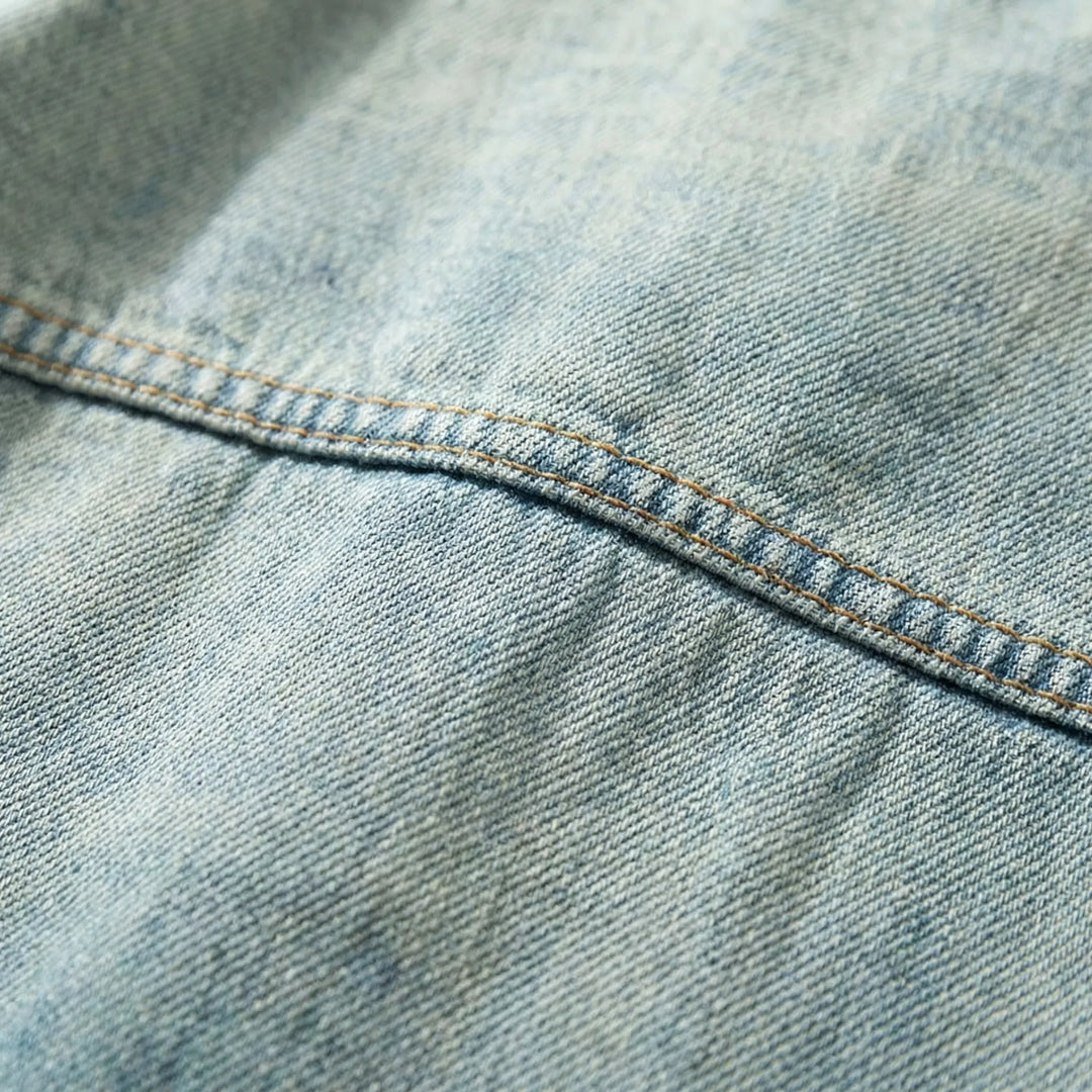 Stylish men's loose fit denim jacket with zip-up design, a must-have for streetwear fashion.