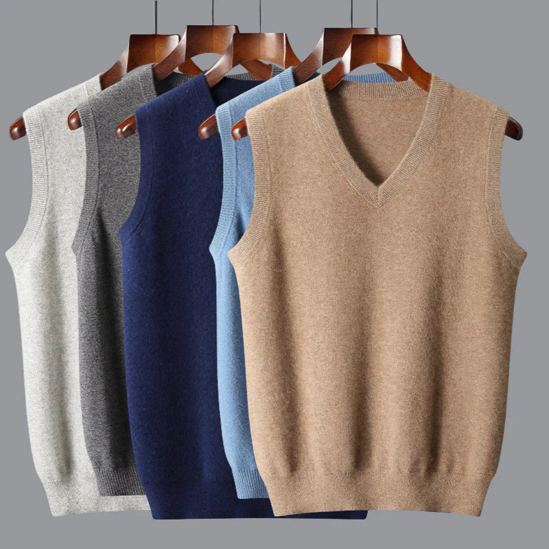 Folded collection of men's cashmere v-neck sweater vests in various colors, emphasizing their premium quality.