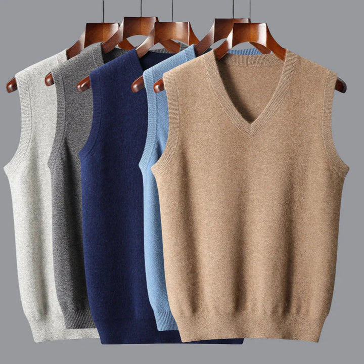 Folded collection of men's cashmere v-neck sweater vests in various colors, emphasizing their premium quality.