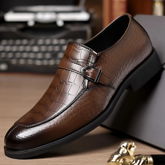 Detail of the polished buckle on men's monk strap leather loafers, emphasizing the luxury and craftsmanship.