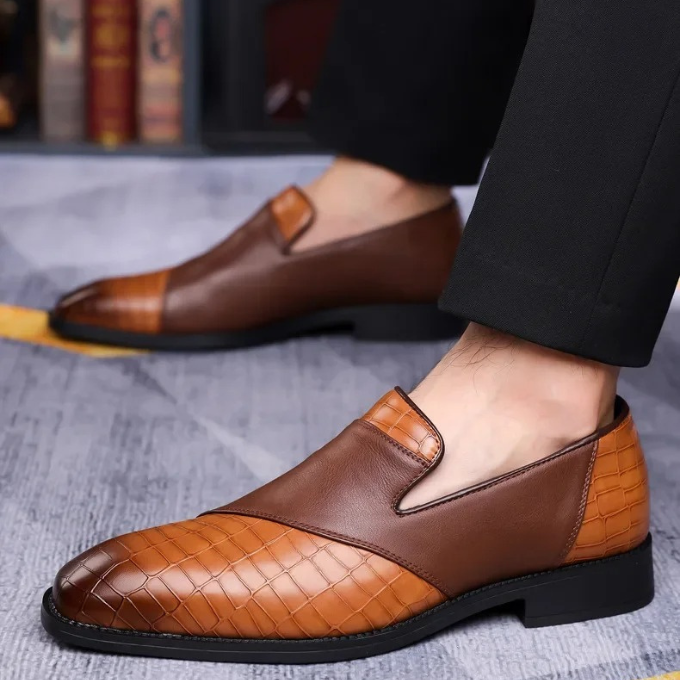 Pair of black croc-textured slip-on loafers for men, showcasing detailed craftsmanship