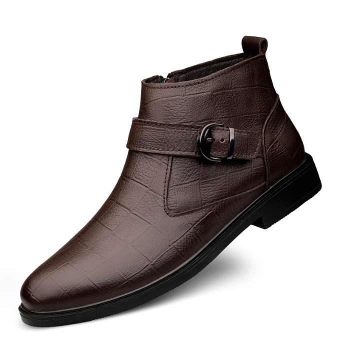 Front view of men's brown full-grain leather ankle boots, emphasizing their sleek silhouette.