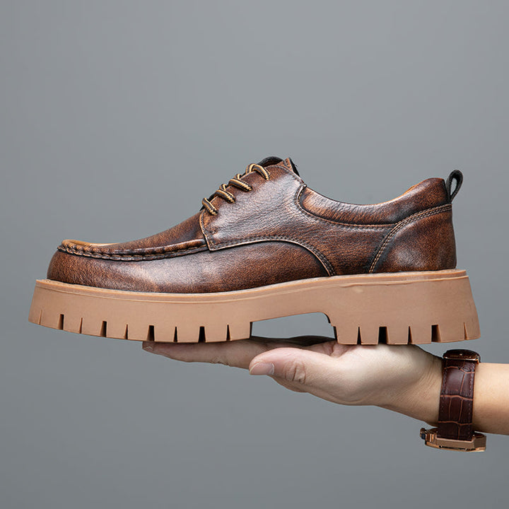 Men's grey casual boots with a clean, minimalist design, emphasizing comfort and style
