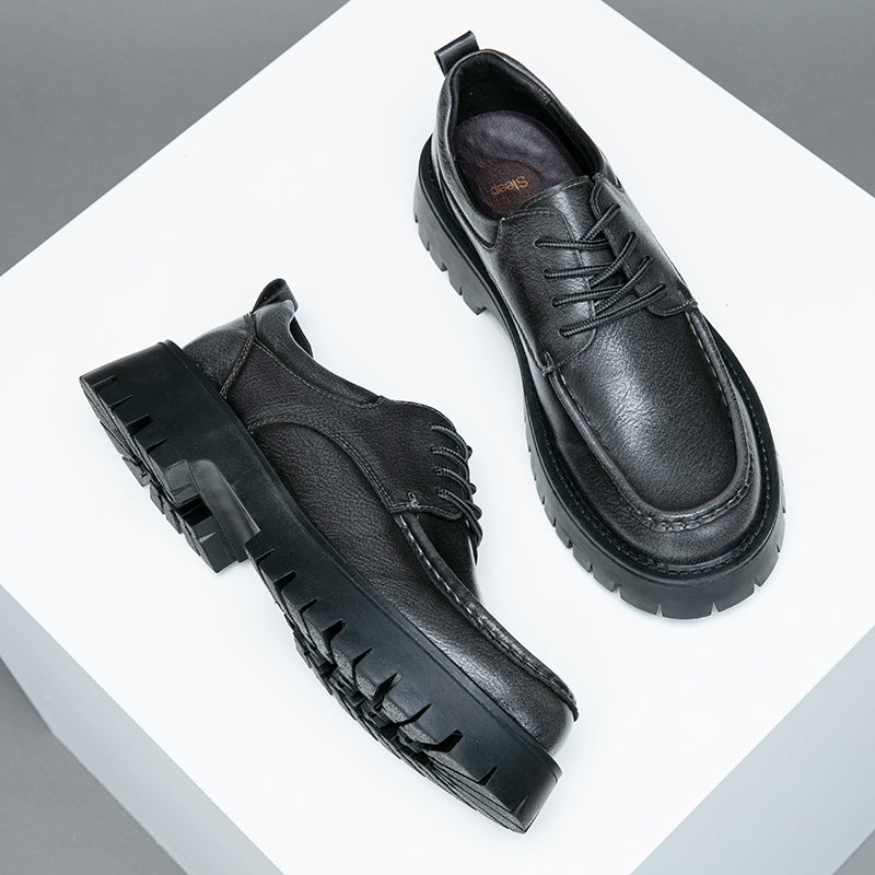 Brown men's casual boots in a studio setting, showcasing their premium craftsmanship