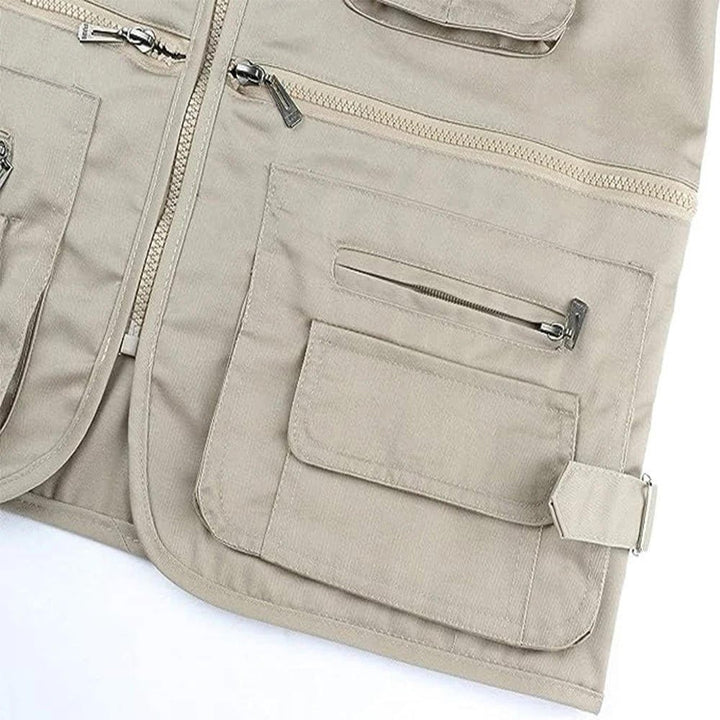 Red men's fishing vest with ample pockets, designed for anglers & outdoor enthusiasts.