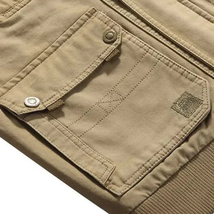 Rugged men's multi-pocket utility vest. Ideal sleeveless casual vest for hiking, travel, and outdoor activities.