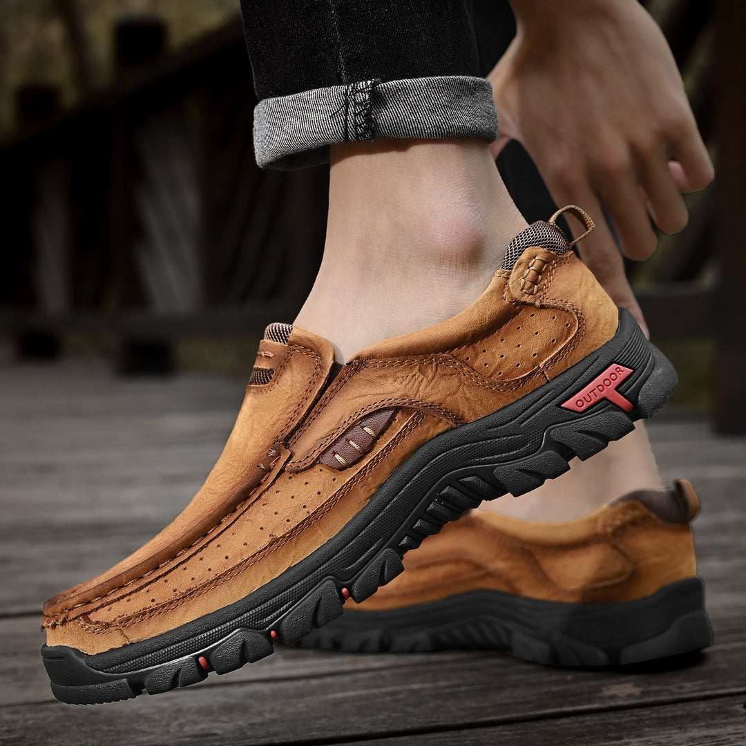 Men's black orthopedic boots with a focus on their comfortable, supportive inner lining.