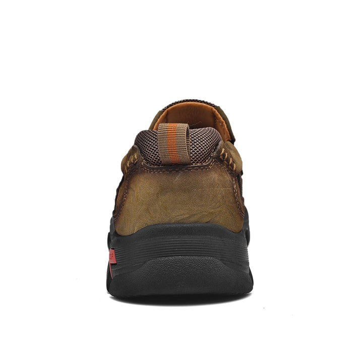 Men's brown orthopedic boots, comfortable, with emphasis on the flexible and supportive sole.