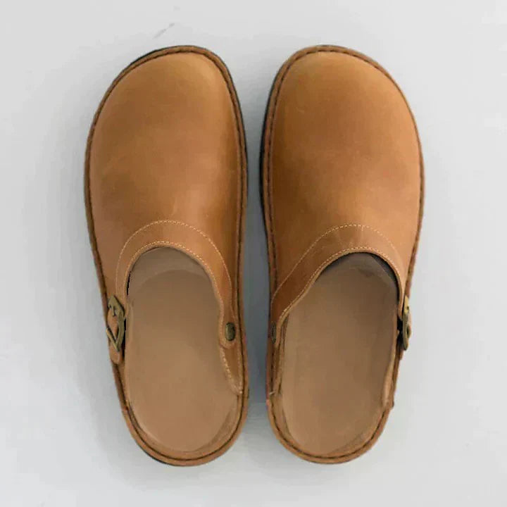 Man wearing black orthopedic comfort clogs, ideal for work, casual outings & all-day support.
