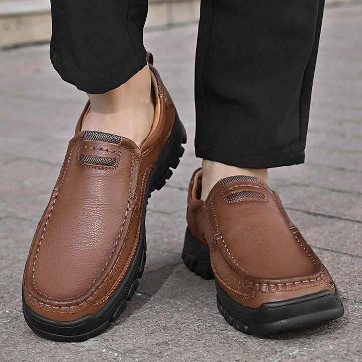 A man lacing up his Men's Orthopedic Comfort Transition Boots, highlighting ease of use and secure fit