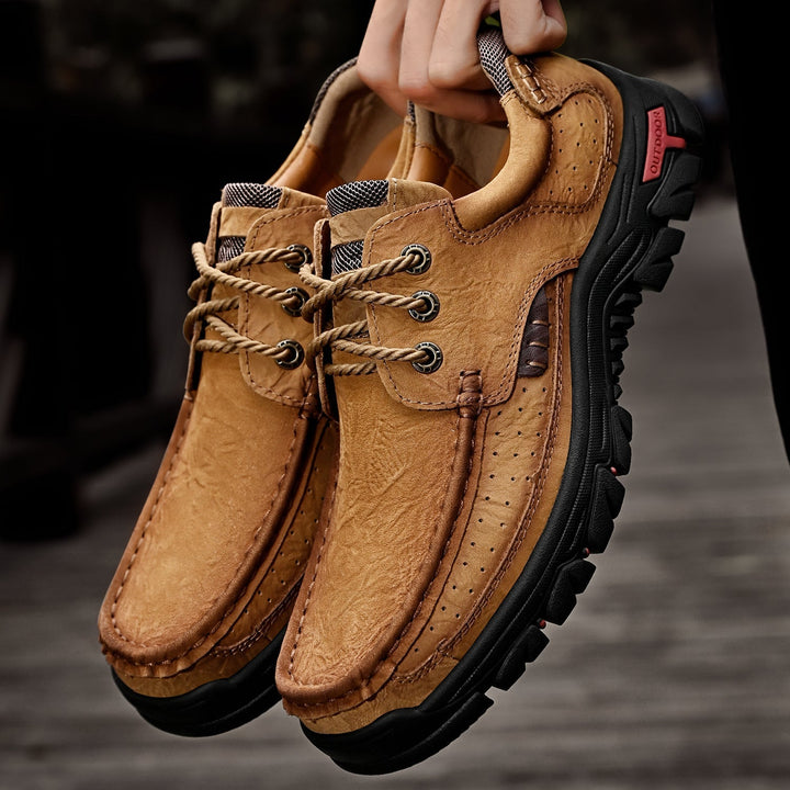Close-up of men's orthopedic leather boots, detailed lacing, sturdy sole