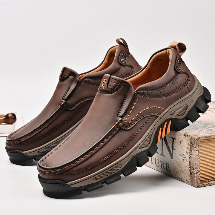 Studio shot of comfortable men's orthopedic transition boots, neutral background