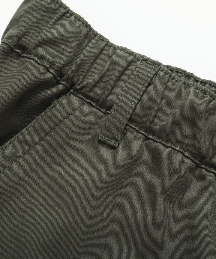 Men's Outdoor Gear: Cargo Pants hanging on a rustic wooden background