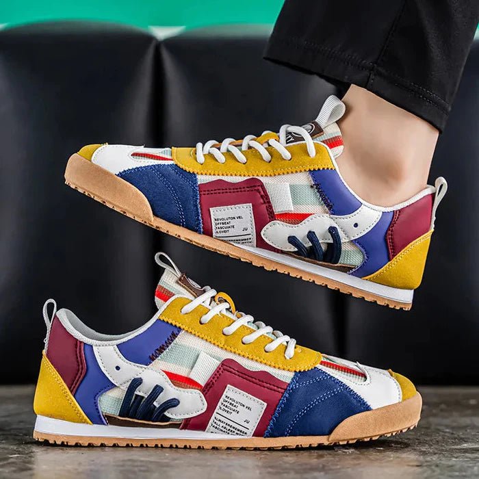 Side profile of men's durable utility sneakers, highlighting the distinct patchwork details & sole.