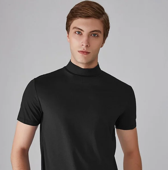 Moisture-wicking men's performance turtleneck, long sleeve activewear. Versatile base layer for all-season athletic comfort.