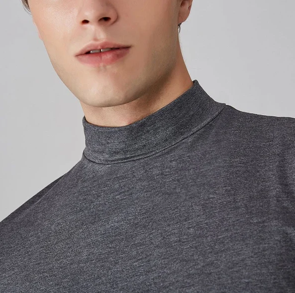 Men's athletic fit performance turtleneck shirt. Long sleeve workout gear, ideal as a base layer for active lifestyles.