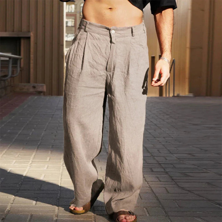 Modern men's pleated wide leg chino pants, showcasing a comfortable loose fit & stylish high waisted design.