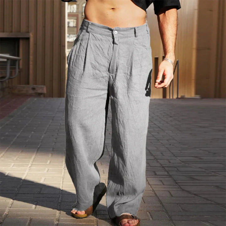 Trendy men's wide leg pleated chino pants, high waisted and loose fitting, perfect for a stylish casual look.