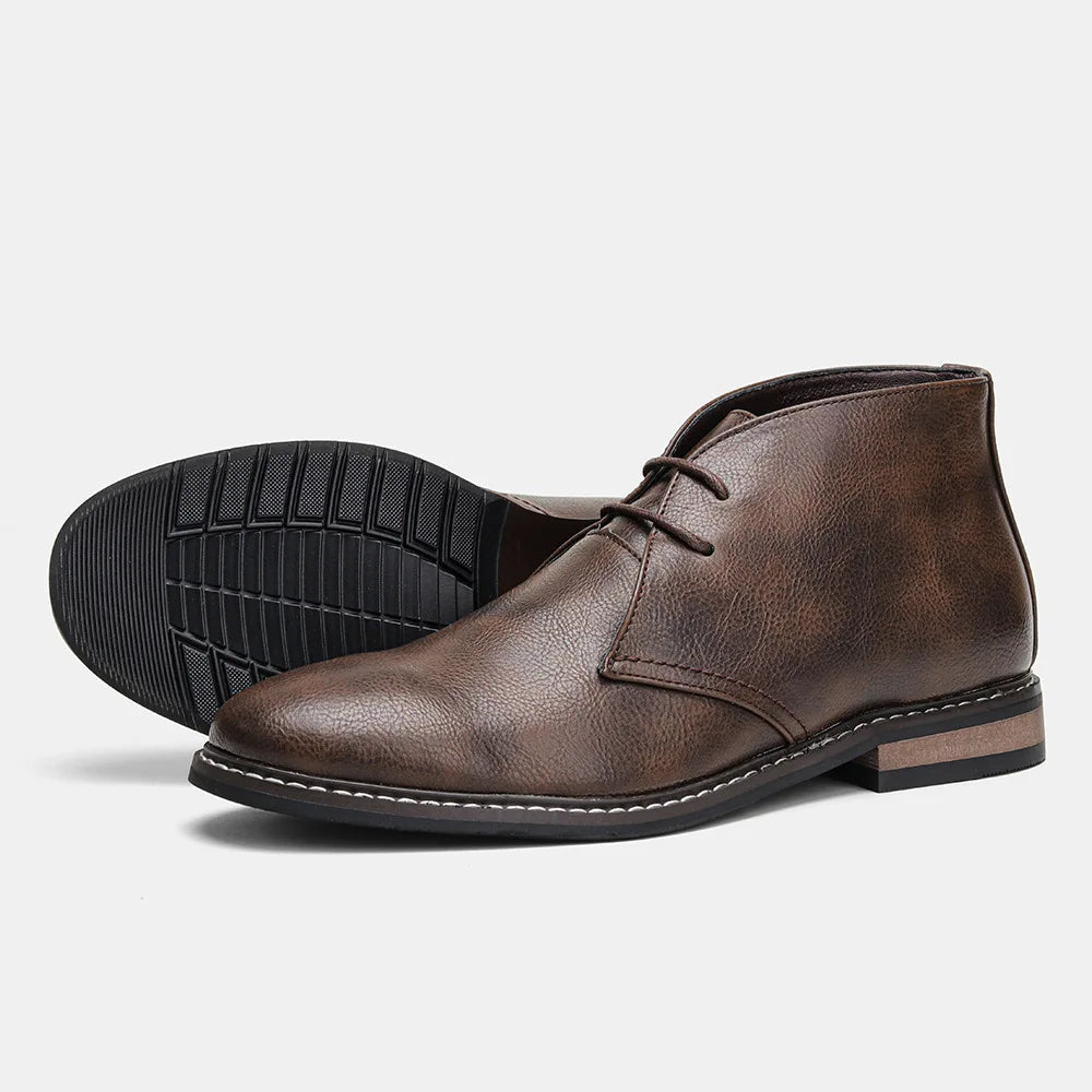 Close-up of men's elegant polished leather ankle boots, ideal for smart casual and formal wear.