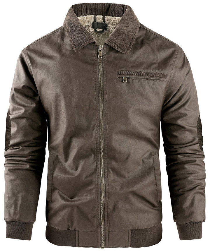 Side profile of a man wearing a premium fleece-lined bomber jacket outdoors
