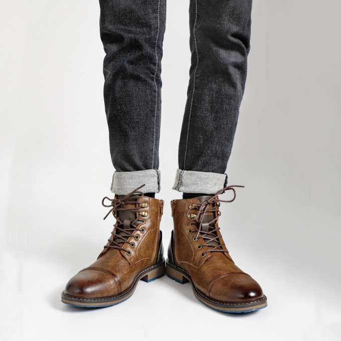 Front view of men's premium leather boots with distinct stitching, emphasizing their stylish appeal.