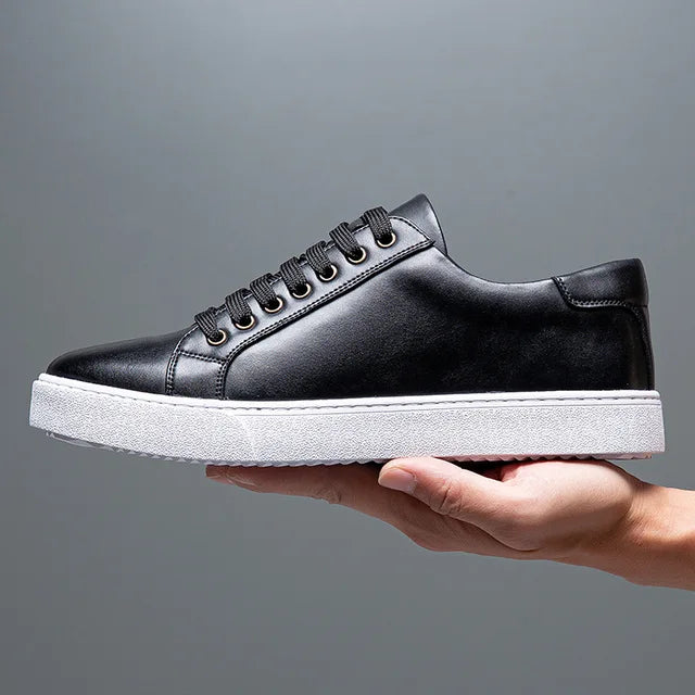 Pair of black men's leather sneakers, perfect for fashion, comfort & everyday wear