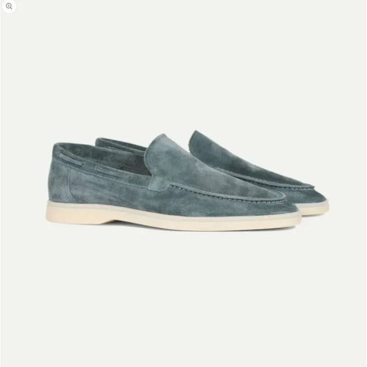 Close-up of a men's premium gray suede slip-on loafer showing texture, ideal for minimalist fashion.