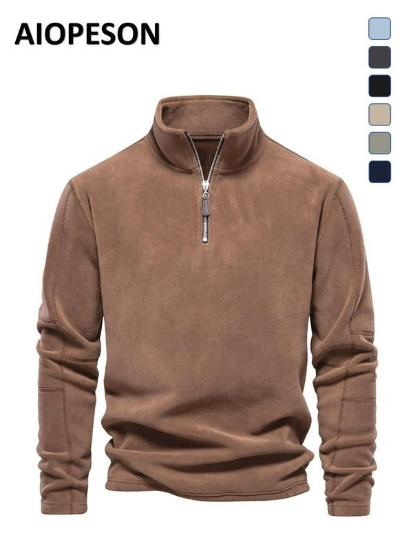 Stylish men's quarter zip fleece in a dark color, a versatile and warm addition to any wardrobe