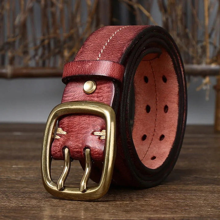 Close-up of the robust brass buckle on a men's casual cowhide leather work belt