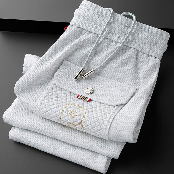 Tapered athletic joggers for men, black, featuring a comfortable drawstring waist.