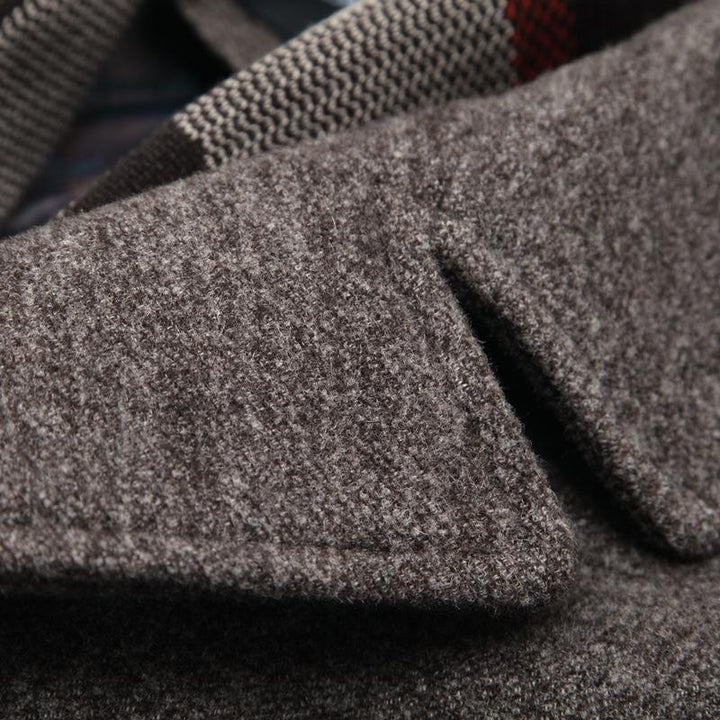 Back view of a men's tailored wool jacket, highlighting the sleek silhouette and craftsmanship