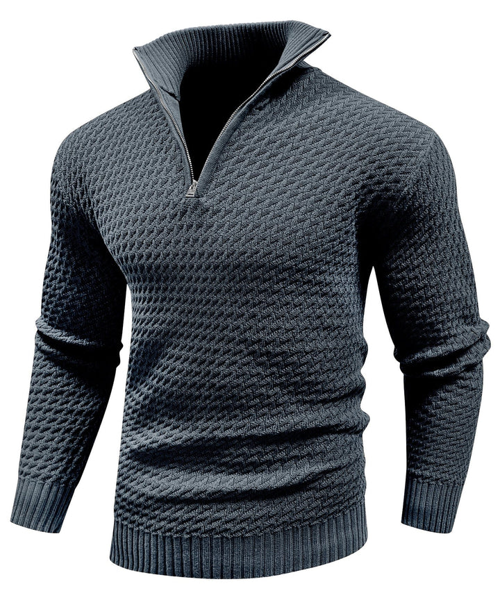 Close-up of a men's quarter-zip turtleneck pullover, showing fabric texture