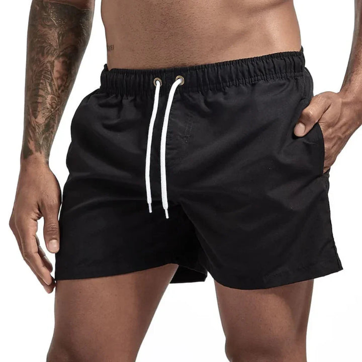 Athletic men's quick-dry swim shorts for water sports, swimming, and comfortable summer beach activities.