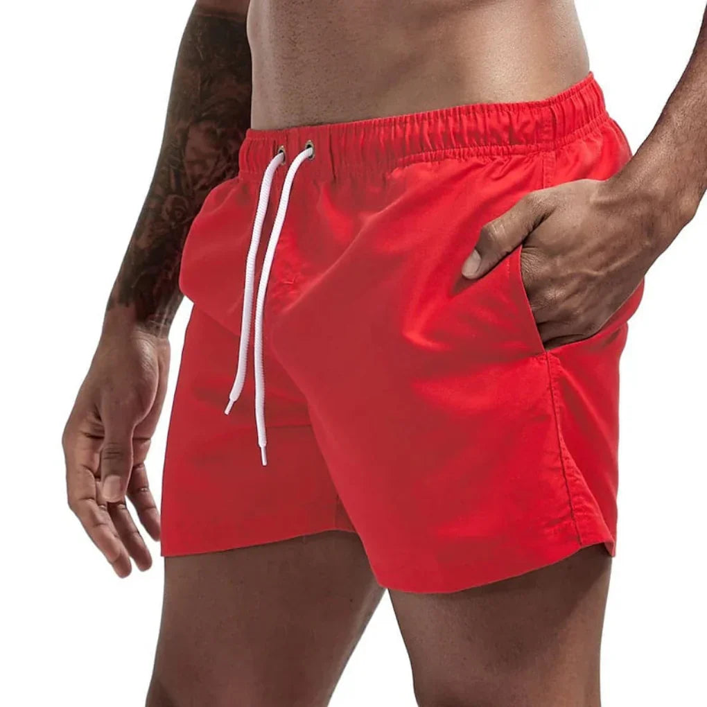 Men's stylish vacation wear swim shorts; quick-dry & comfortable for beach, pool, and summer adventures.