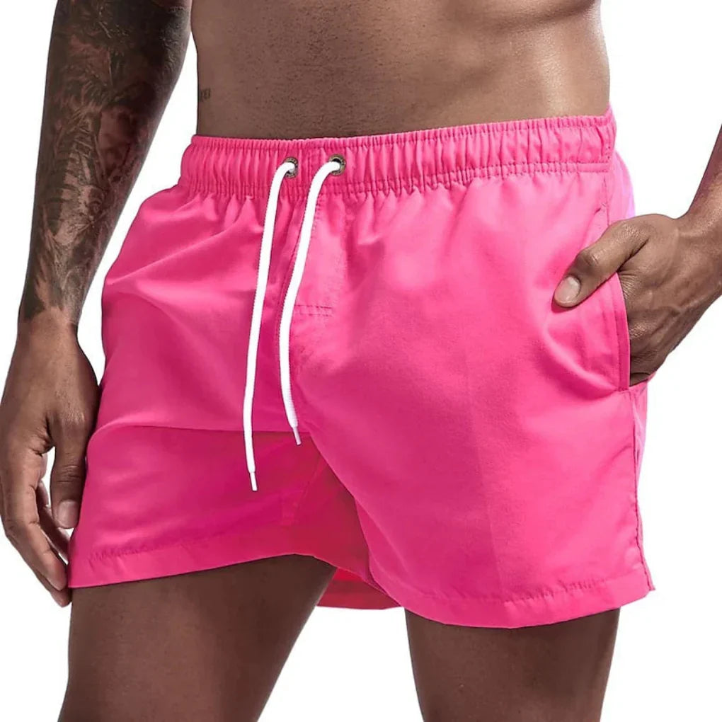 Performance men's swim shorts with quick-dry fabric, ideal for beach, pool, and athletic summer activities.