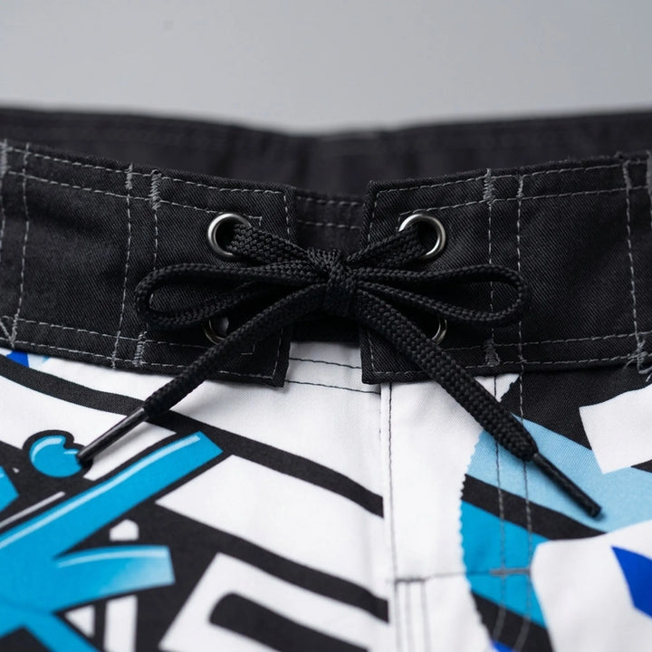Men's quick-dry swim shorts featuring a modern geometric print, great for beachwear & pool.