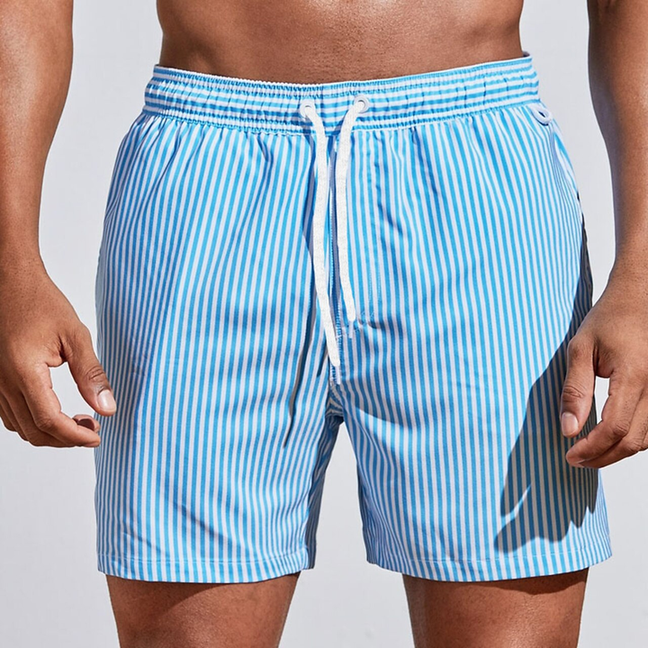 Detail shot: men's quick-dry striped swim trunks fabric, showcasing pattern, texture, and drawstring.
