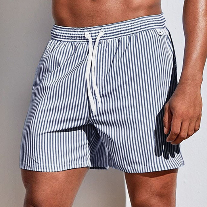 Vibrant striped men's quick-dry swim trunks with an adjustable drawstring and comfortable fit for summer.