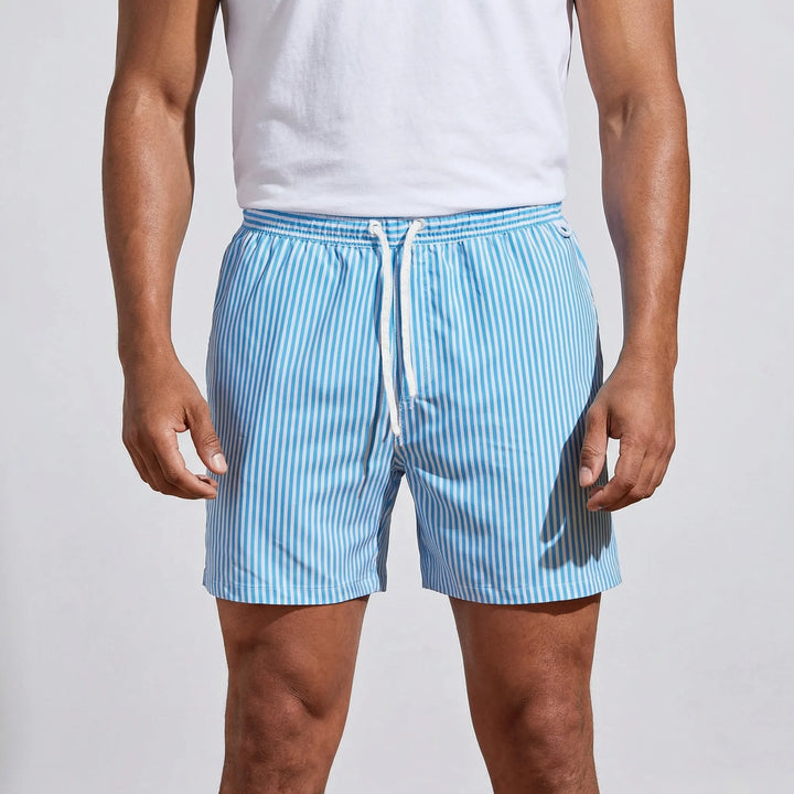 Performance men's quick-dry striped swim trunks. Modern beach & pool shorts with athletic style.