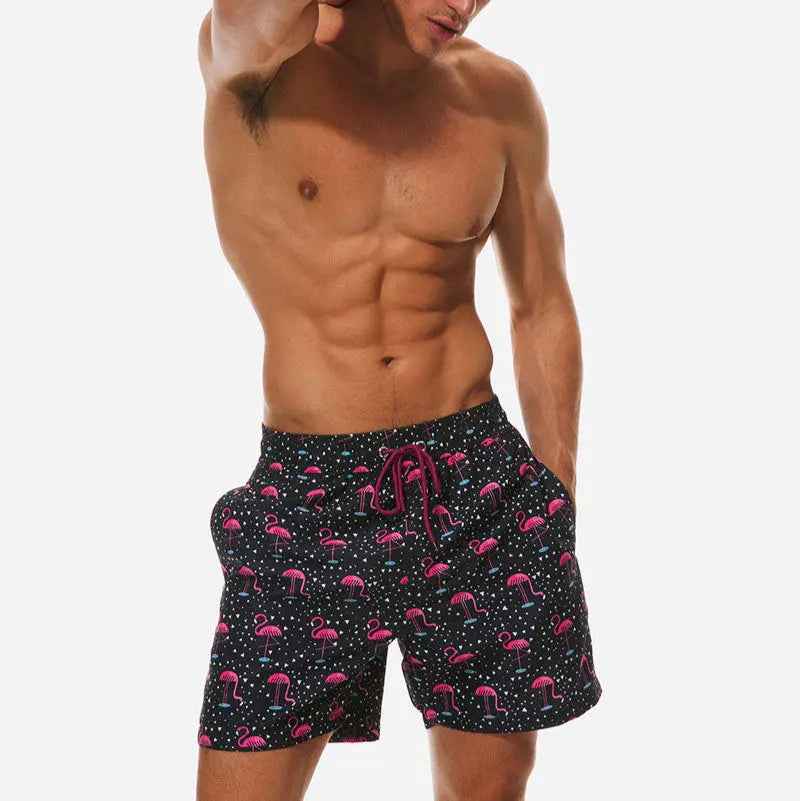 Tropical print quick-dry men's swim trunks, ideal beachwear for summer holidays.