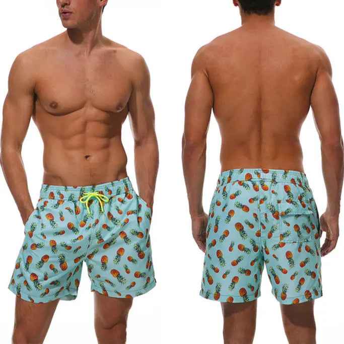 Men's quick-dry tropical swim trunks, essential for beach holidays & pool vacations.