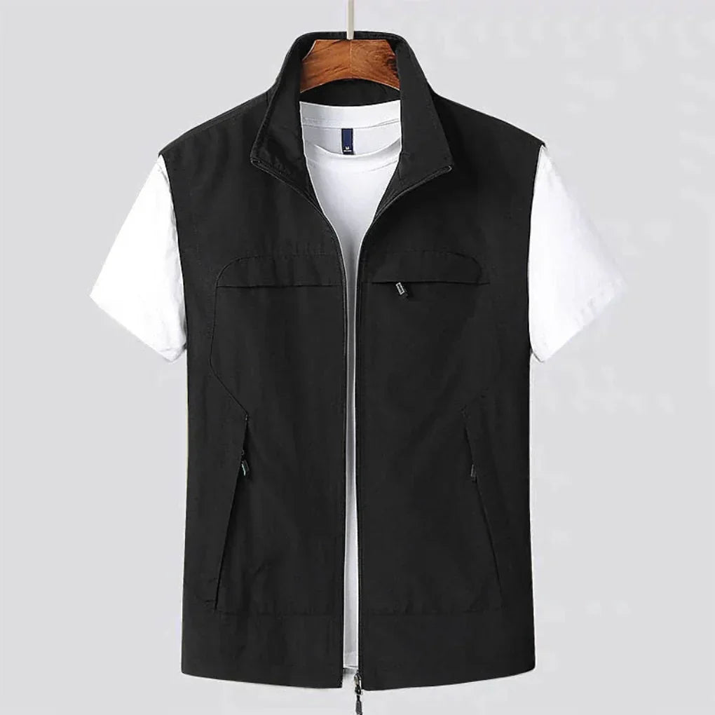 Close-up of men's multi-pocket quick-dry vest, showcasing utility pockets for active travel & hiking gear storage.
