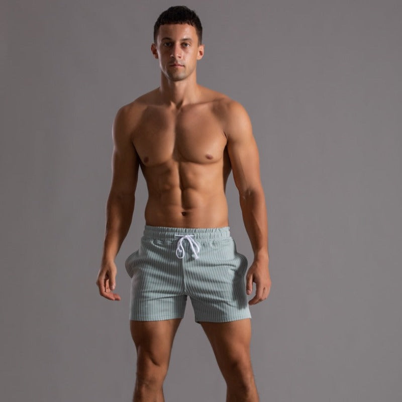 Holiday essential: Men's quick-dry, stylish swim shorts. Comfortable ripstop for beach & pool days.