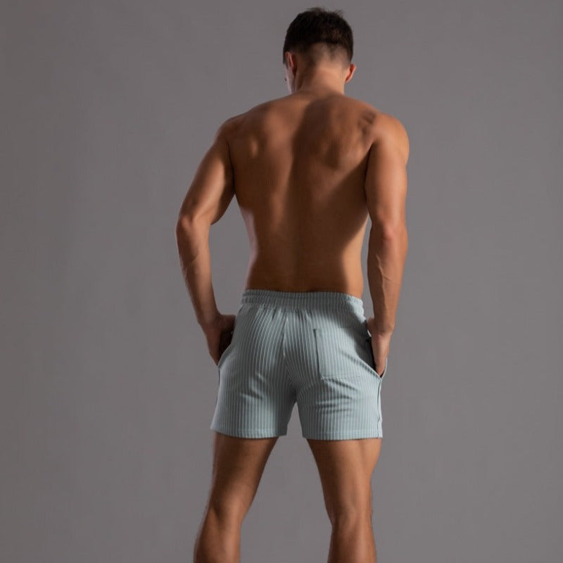 Modern men's quick-dry swim shorts. Stylish ripstop polyester for a fashionable beach & pool look.