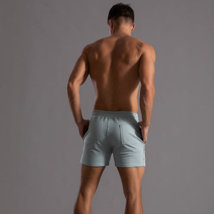 Modern men's quick-dry swim shorts. Stylish ripstop polyester for a fashionable beach & pool look.