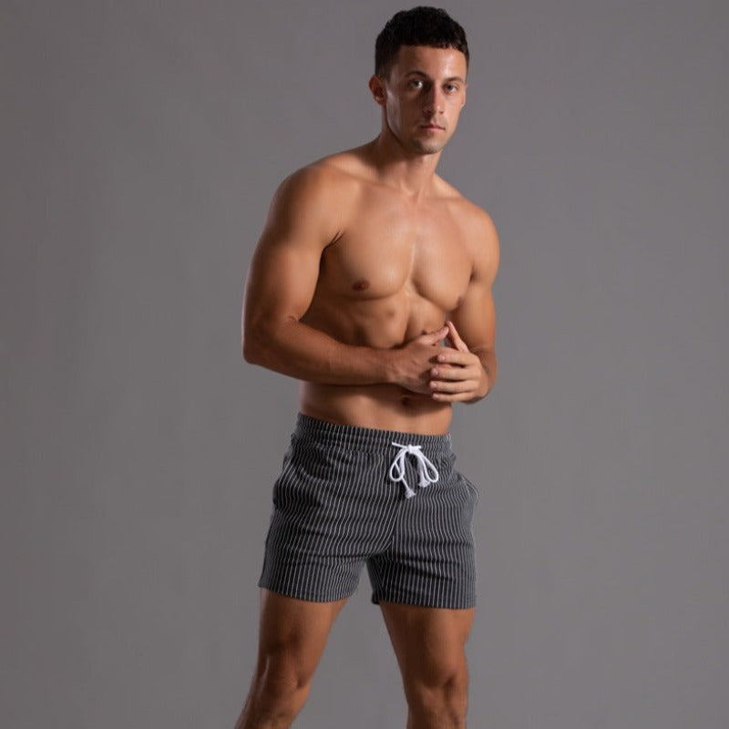 Men's quick-dry swim shorts for outdoor activities. Stylish beach & pool athletic wear.
