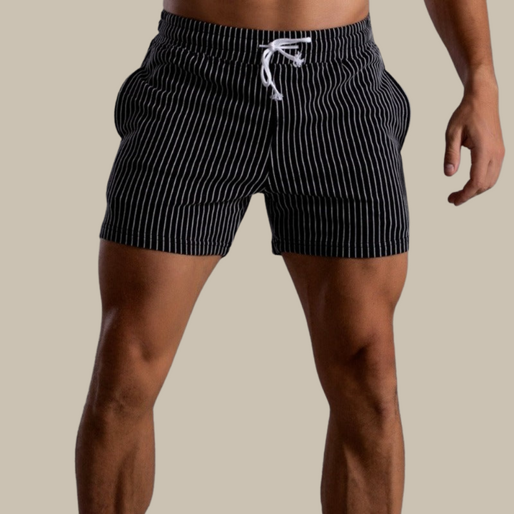 Stylish men's swim shorts. Fashionable quick-dry beachwear for pool, vacation & summer comfort.