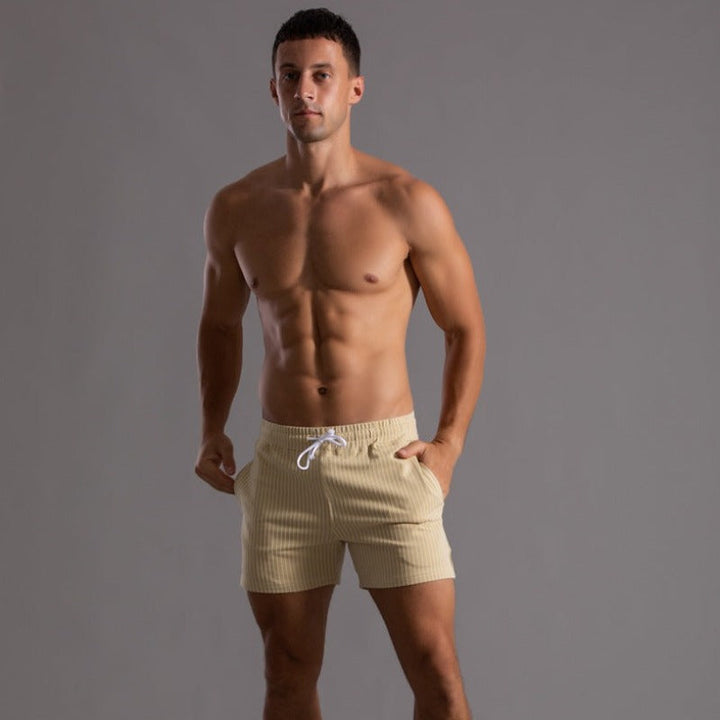 Vacation essential: Men's quick-dry swim shorts. Stylish ripstop beachwear for summer travel.